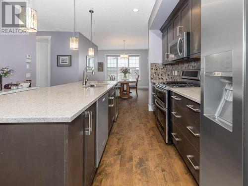 344 Quarry Park Boulevard Se, Calgary, AB - Indoor Photo Showing Kitchen With Upgraded Kitchen