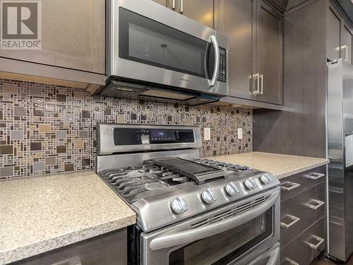 344 Quarry Park Boulevard Se, Calgary, AB - Indoor Photo Showing Kitchen With Stainless Steel Kitchen