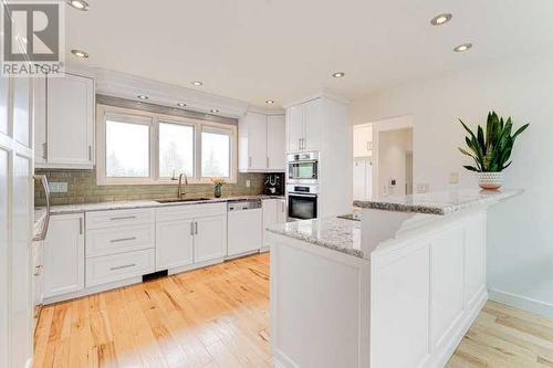 72 Canova Road Sw, Calgary, AB - Indoor Photo Showing Kitchen With Upgraded Kitchen