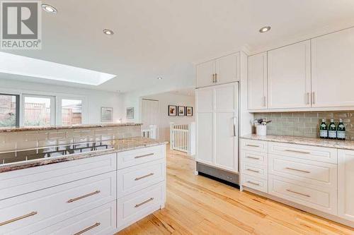 72 Canova Road Sw, Calgary, AB - Indoor Photo Showing Kitchen With Double Sink