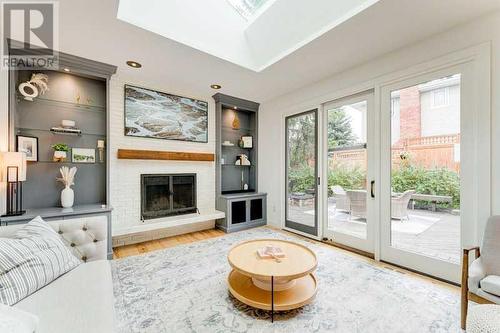 72 Canova Road Sw, Calgary, AB - Indoor Photo Showing Living Room With Fireplace