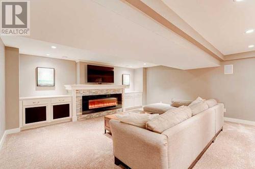 72 Canova Road Sw, Calgary, AB - Indoor Photo Showing Other Room With Fireplace