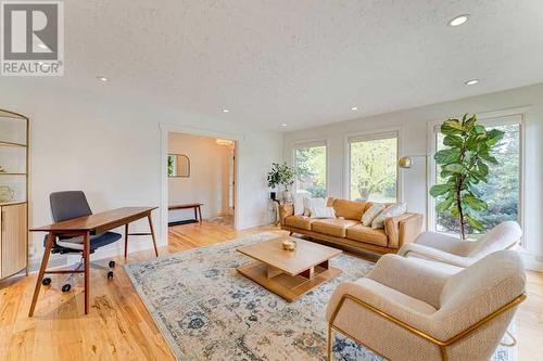 72 Canova Road Sw, Calgary, AB - Indoor Photo Showing Living Room