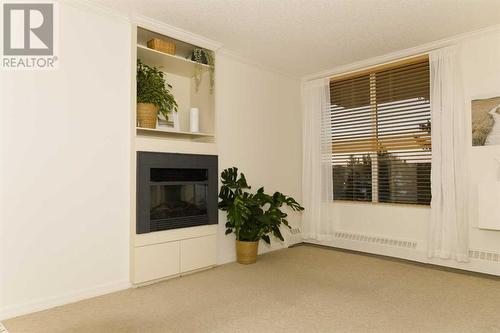 Living Room - 308, 4603 Varsity Drive Nw, Calgary, AB - Indoor With Fireplace