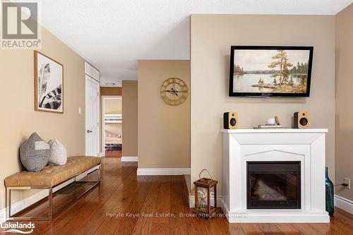 80 Stephenson Rd 7 E, Huntsville (Stephenson), ON - Indoor Photo Showing Living Room With Fireplace