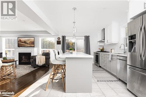 74 Fieldstream Chase, Bracebridge, ON - Indoor Photo Showing Kitchen With Fireplace With Upgraded Kitchen