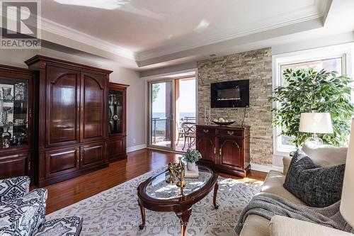 204 - 5340 Lakeshore Road, Burlington, ON - Indoor Photo Showing Living Room With Fireplace