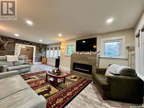 695 3Rd Street E, Shaunavon, SK - Indoor Photo Showing Living Room With Fireplace