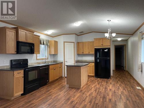 5332 42 Street, Fort Nelson, BC - Indoor Photo Showing Kitchen With Double Sink