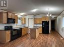 5332 42 Street, Fort Nelson, BC  - Indoor Photo Showing Kitchen With Double Sink 