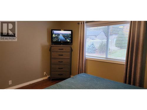 1918 Caughlin Road, Fruitvale, BC - Indoor Photo Showing Bedroom