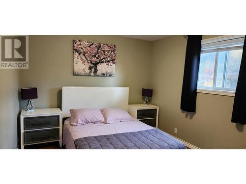 1918 Caughlin Road, Fruitvale, BC - Indoor Photo Showing Bedroom