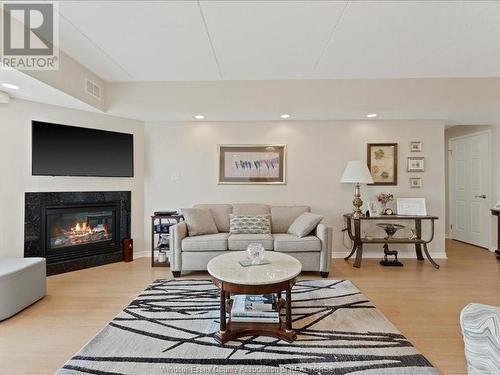 325 Village Grove Unit# 506, Tecumseh, ON - Indoor Photo Showing Living Room With Fireplace