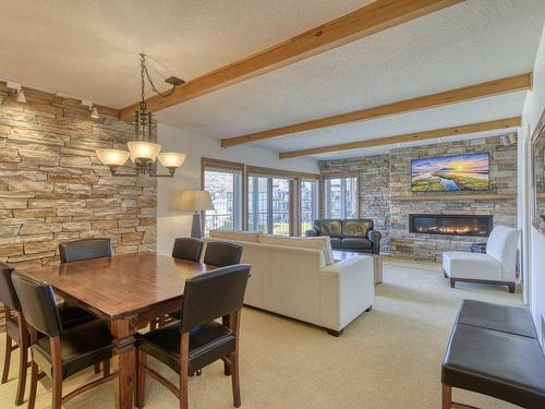 Dining room - 4622-116 Rue Pinoteau, Mont-Tremblant, QC - Indoor Photo Showing Dining Room With Fireplace