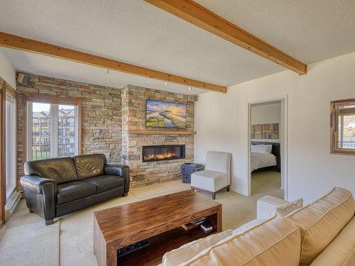 Living room - 4622-116 Rue Pinoteau, Mont-Tremblant, QC - Indoor Photo Showing Living Room With Fireplace