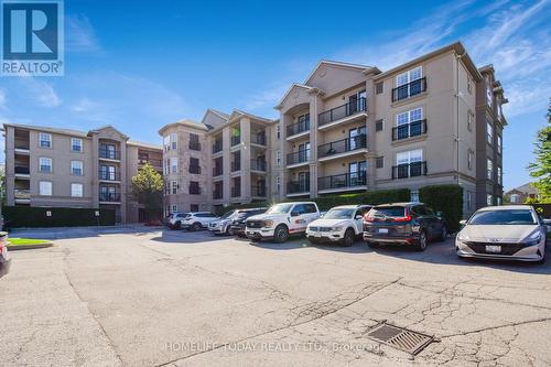 208 - 1487 Maple Avenue, Milton, ON - Outdoor With Facade