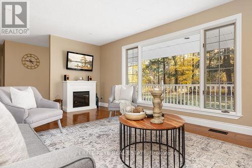 80 Stephenson Road 7 E, Huntsville, ON - Indoor Photo Showing Living Room With Fireplace