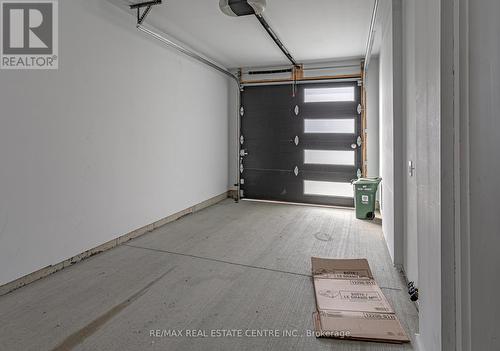 93 - 3380 Singleton Avenue, London, ON - Indoor Photo Showing Garage