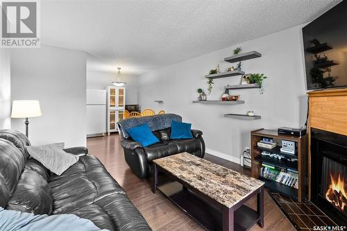 313 3308 33Rd Street W, Saskatoon, SK - Indoor Photo Showing Living Room With Fireplace