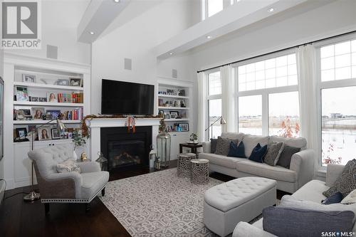 160 Hanley Crescent, Edenwold Rm No. 158, SK - Indoor Photo Showing Living Room With Fireplace