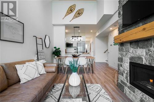 406 - 16 Beckwith Lane W, Blue Mountains, ON - Indoor Photo Showing Living Room With Fireplace