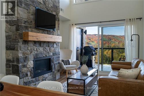 406 - 16 Beckwith Lane W, Blue Mountains, ON - Indoor Photo Showing Living Room With Fireplace