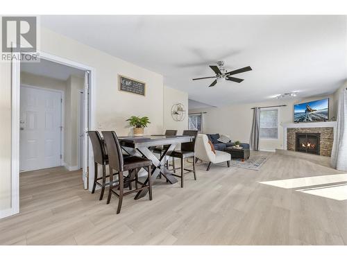 3832 Glen Canyon Drive, West Kelowna, BC - Indoor Photo Showing Dining Room With Fireplace