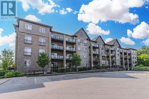 210 - 44 Ferndale Drive S, Barrie, ON - Outdoor With Balcony With Facade