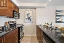 217 - 61 Clarington Boulevard, Clarington (Bowmanville), ON  - Indoor Photo Showing Kitchen With Double Sink 