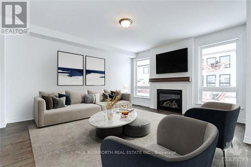 1006 Brian Good Avenue, Ottawa, ON - Indoor Photo Showing Living Room With Fireplace