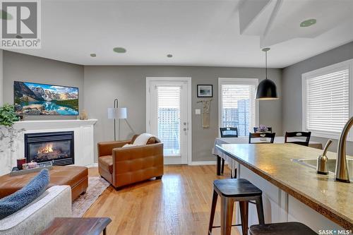 A4 33 Wood Lily Drive, Moose Jaw, SK - Indoor Photo Showing Living Room With Fireplace