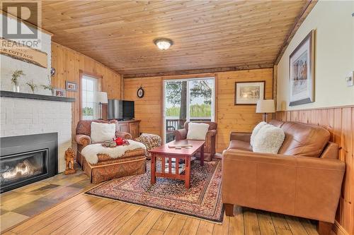 729 Dry Pine Bay Rd, Alban, ON - Indoor Photo Showing Living Room With Fireplace