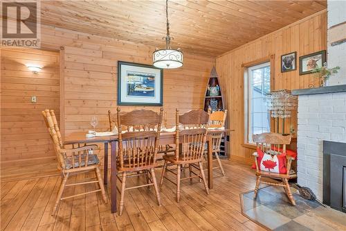 729 Dry Pine Bay Rd, Alban, ON - Indoor Photo Showing Dining Room With Fireplace