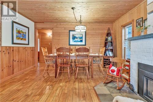 729 Dry Pine Bay Rd, Alban, ON - Indoor Photo Showing Dining Room With Fireplace