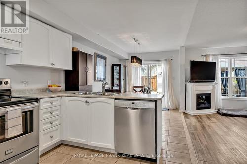 263 Bowen Drive, Peterborough (Northcrest), ON - Indoor Photo Showing Kitchen With Fireplace With Stainless Steel Kitchen With Double Sink