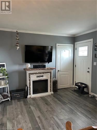 19 Piette Street, Verner, ON - Indoor Photo Showing Living Room With Fireplace