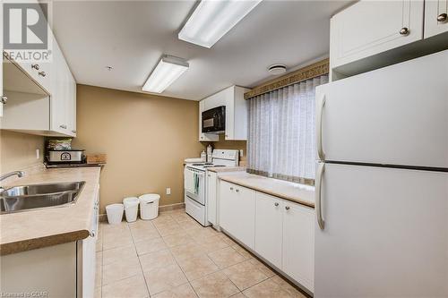 625 St David Street S Unit# 412, Fergus, ON - Indoor Photo Showing Kitchen With Double Sink