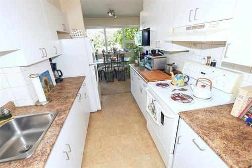 205 71 Roslyn Road, Winnipeg, MB - Indoor Photo Showing Kitchen With Double Sink