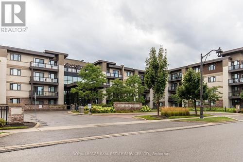 313 - 128 Garden Drive, Oakville, ON - Outdoor With Facade