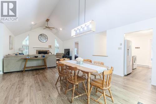 Dining room with updated lighting - 10248 Pinetree Drive, Lambton Shores (Grand Bend), ON - Indoor Photo Showing Dining Room