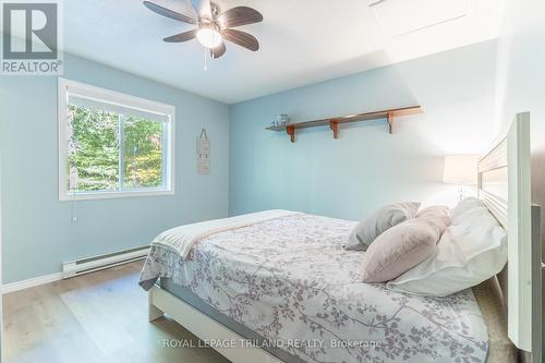 Bedroom 3 with large yard facing window - 10248 Pinetree Drive, Lambton Shores (Grand Bend), ON - Indoor Photo Showing Bedroom