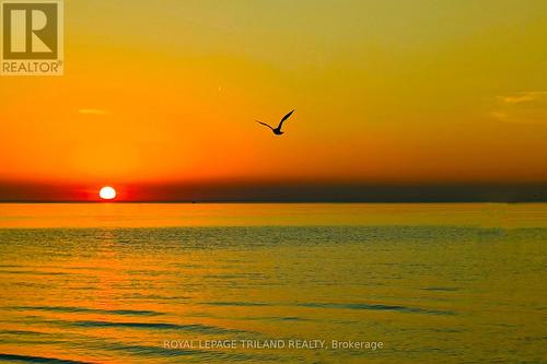 The best sunsets in the world - 10248 Pinetree Drive, Lambton Shores (Grand Bend), ON - Outdoor With Body Of Water With View