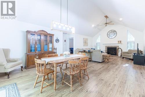 Open concept dining room/living room - 10248 Pinetree Drive, Lambton Shores (Grand Bend), ON - Indoor Photo Showing Dining Room With Fireplace