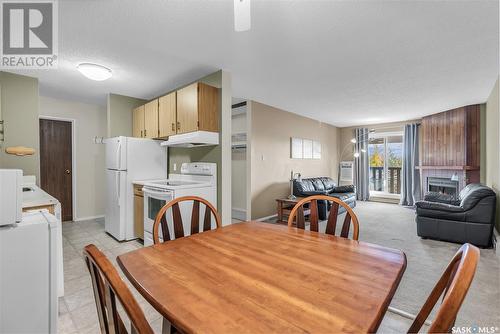 735 510 Prairie Avenue, Saskatoon, SK - Indoor Photo Showing Dining Room With Fireplace