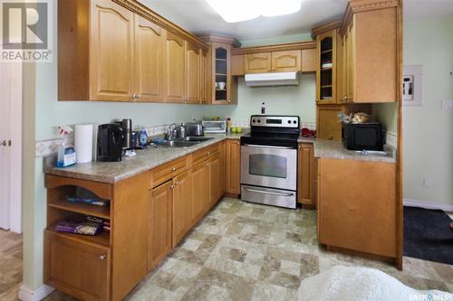 235 Sidney Street, Swift Current, SK - Indoor Photo Showing Kitchen With Double Sink