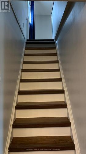 Wide, straight stairs to second floor. - 3109 Napperton Drive, Adelaide Metcalfe, ON - Indoor Photo Showing Other Room