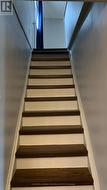 Wide, straight stairs to second floor. - 