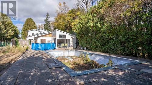 Pool has not been used in years. - 3109 Napperton Drive, Adelaide Metcalfe, ON - Outdoor With In Ground Pool