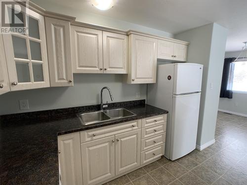 A 4415 Heritage Crescent, Fort Nelson, BC - Indoor Photo Showing Kitchen With Double Sink