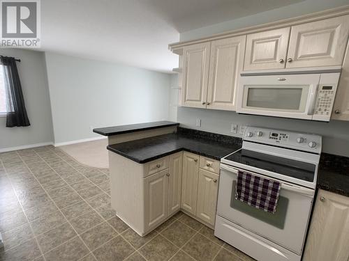 A 4415 Heritage Crescent, Fort Nelson, BC - Indoor Photo Showing Kitchen